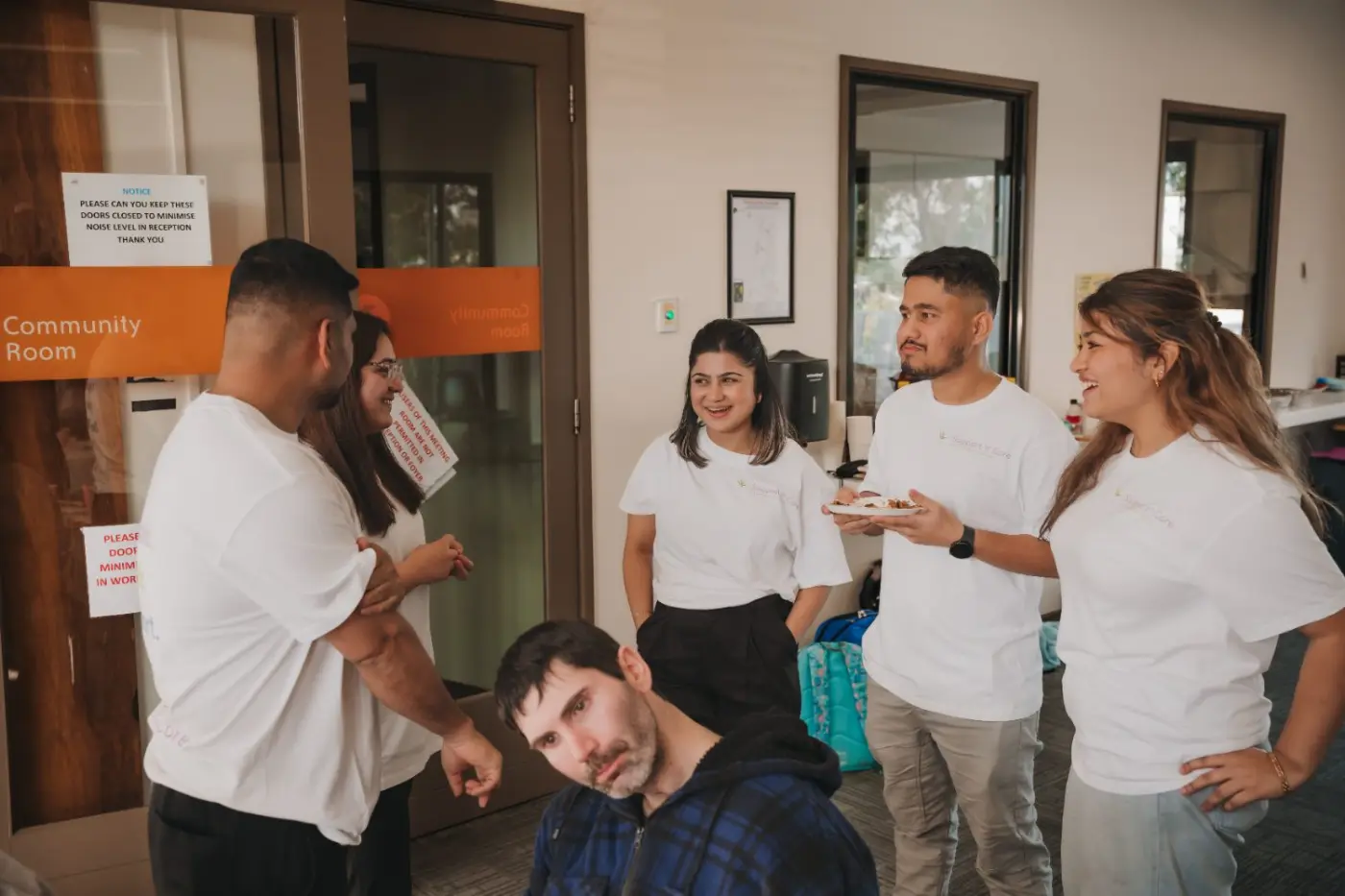 Team members sharing a laugh with a participant