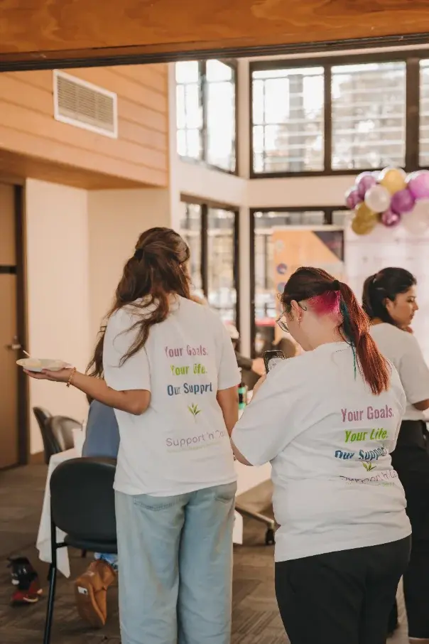Team members in matching T-shirts at a group event